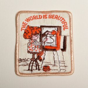 1970s Holly Hobbie The World Is Beautiful Embroidered Sew On Patch Artist Painting Art Applique