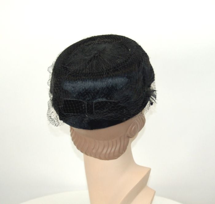 1960s black feather pillbox hat with veil and velvet bow 