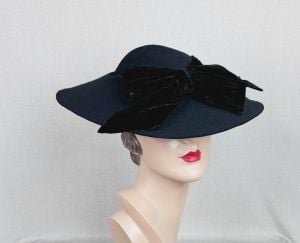 Vintage 40s Black Felt Wide Brim Tilt Hat with Velvet Bow and Back Placement Band by Baer-Kranich - Fashionconservatory.com