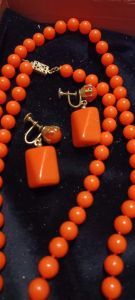 Antique 1920s Orange Bakelite Flapper Era 54 1/2 inches long necklace with matching screwback earrin