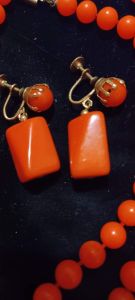 Antique 1920s Orange Bakelite Flapper Era 54 1/2 inches long necklace with matching screwback earrin - Fashionconservatory.com