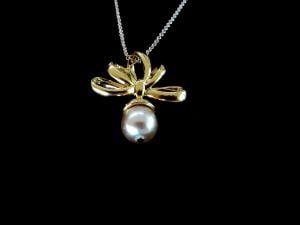 Vintage NOLAN MILLER gold tone off white faux pearl pendant on 14 GP 16'' chain 1980's - Fashionconservatory.com