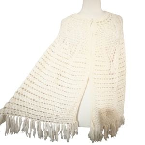 Vintage 1970’s Cream Crochet Cape with Fringe and Irridescent Button Down Front - Fashionconservatory.com