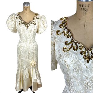 1980s satin sheath gown with gold lace and puffed sleeves