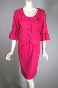 Barbie pink acrylic 1960s skirt suit with bow and ruffle trim 