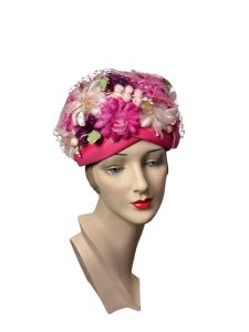 1960s pink flowered hat with netting Size 22