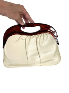 1970s clutch bag with caramel lucite handle and lifting clasp - Fashionconservatory.com