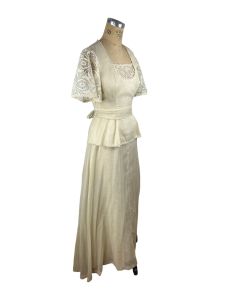 1970s ivory maxi prairie dress with lace flutter sleeves and peplum  - Fashionconservatory.com