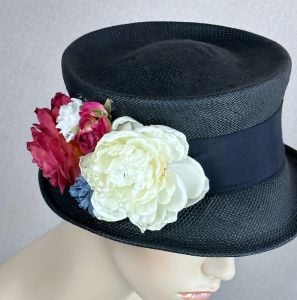 Nice black vintage hat styled as a narrow brim top hat.  Body is a tight weave straw with a deep ind