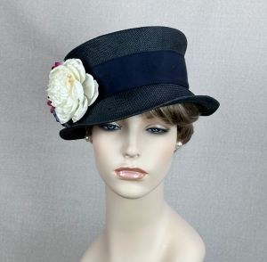 Nice black vintage hat styled as a narrow brim top hat.  Body is a tight weave straw with a deep ind - Fashionconservatory.com